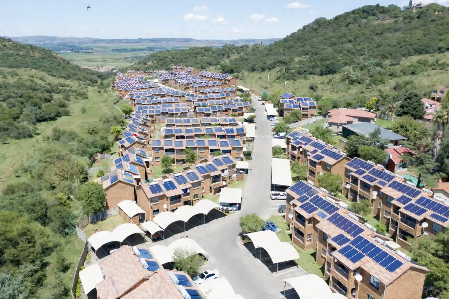 Aerial view of Southgate Ridge apartments among green hills